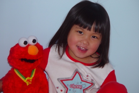 Kasen with her friend Elmo